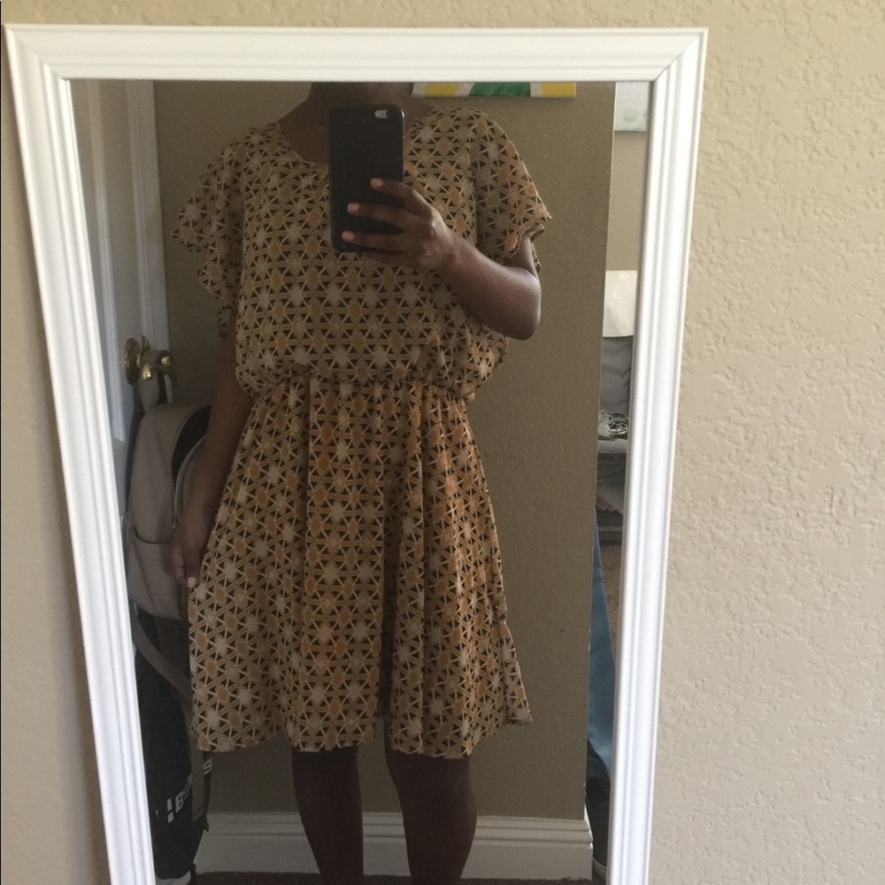 A gold colored dress